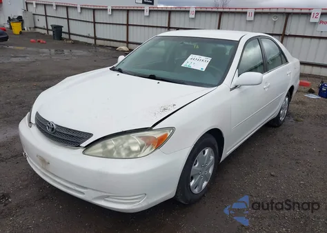 2003 Toyota Camry Le z USA, uszkodzony, nr VIN JTDBE32KX30141365